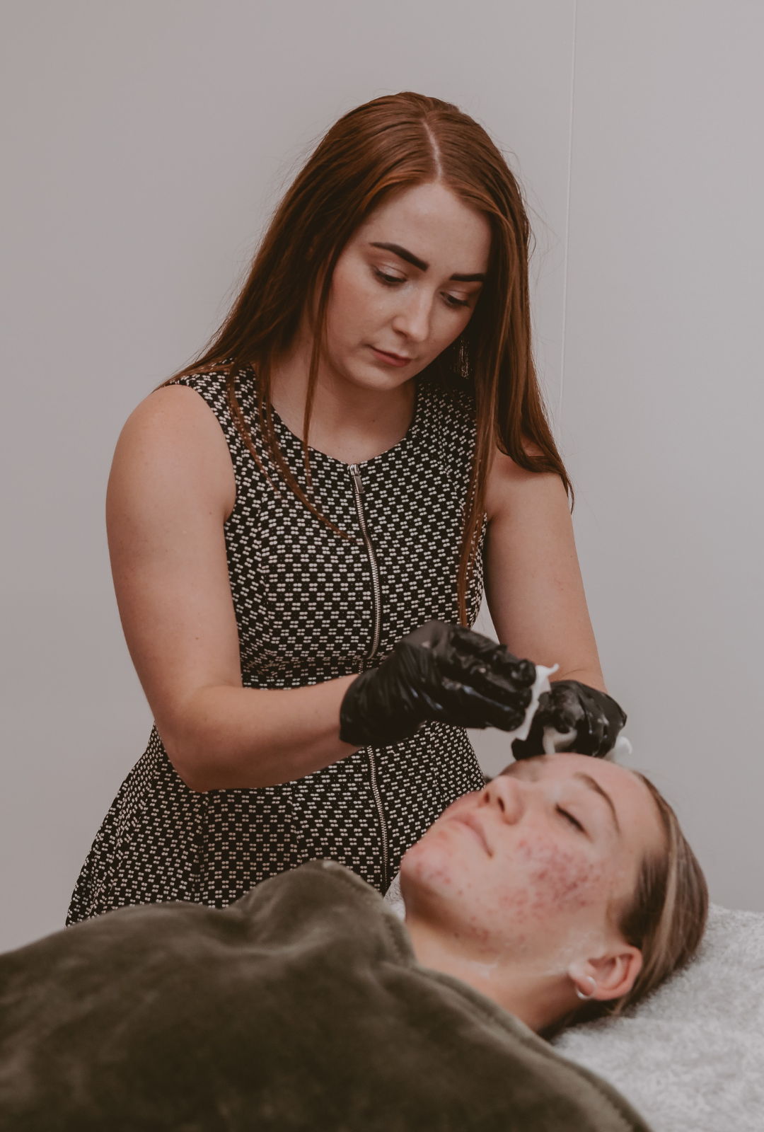 A model receiving a treatment at Mel Hornery Cosmetics, showcasing the advanced services offered by top-rated skin clinics.