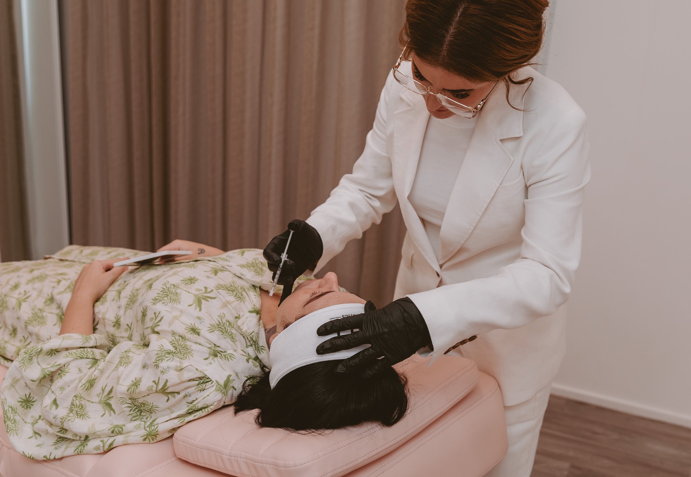 Mel Hornery, owner of Mel Hornery Cosmetics, expertly administering Botox to a model in one of the leading skin clinics.