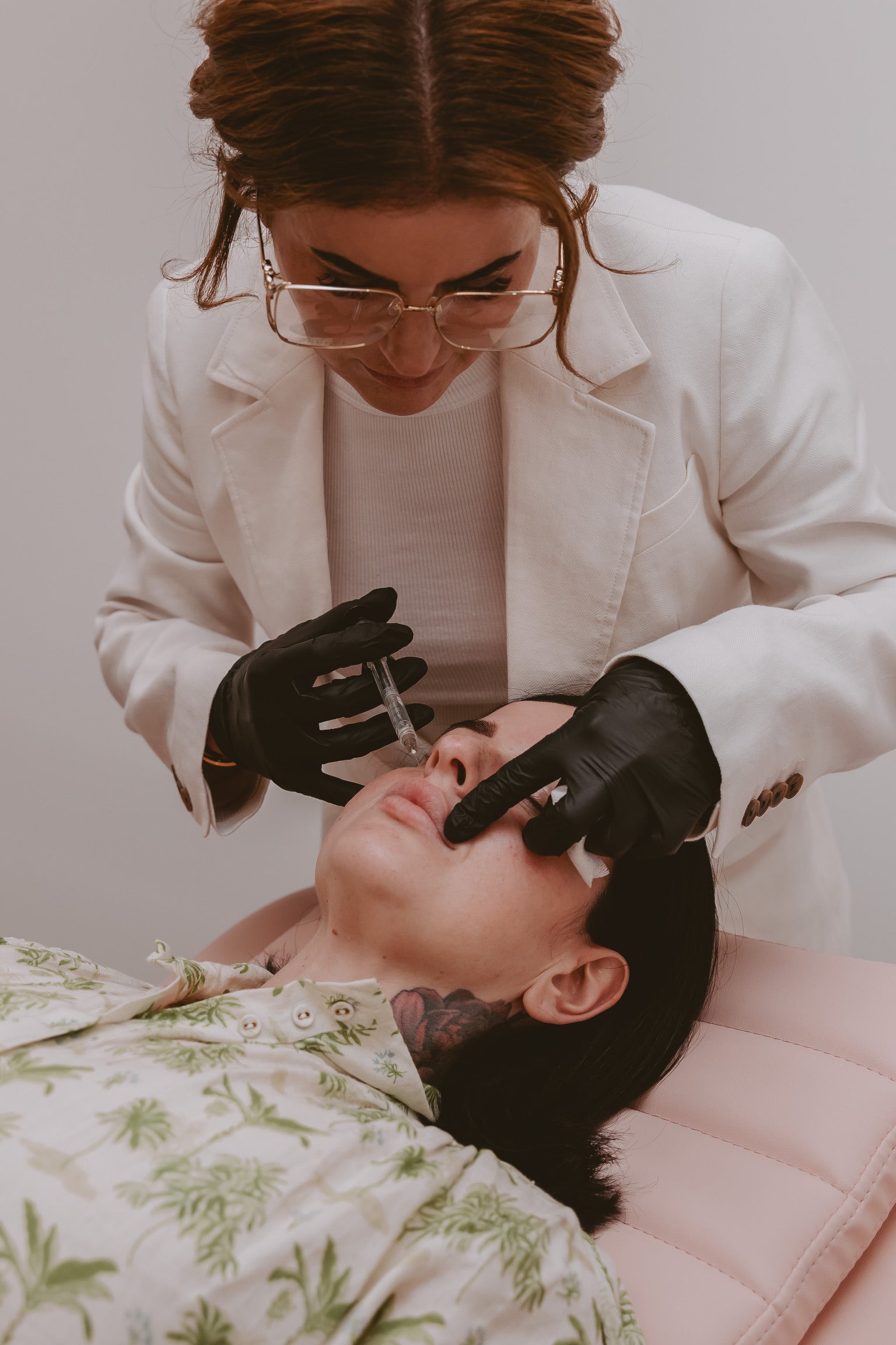 A model receiving lip filler treatment at Mel Hornery Cosmetics, showcasing the advanced services offered by top-rated skin clinics.