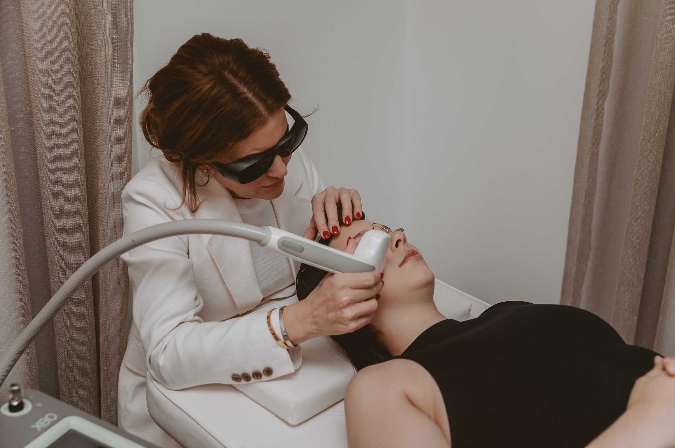 Mel Hornery, owner of Mel Hornery Cosmetics, expertly administering laser to a model in one of the leading skin clinics.