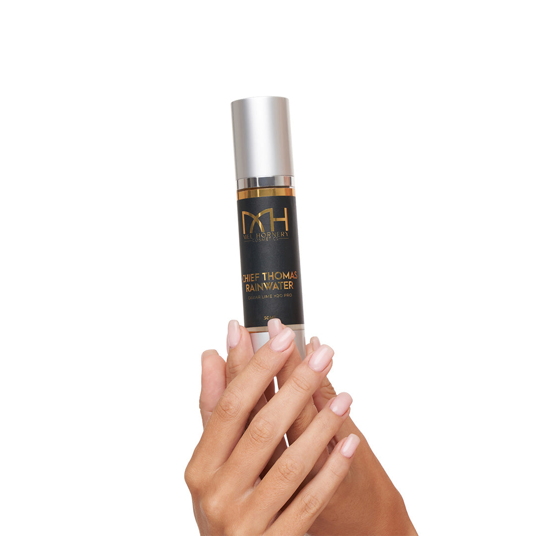 hands holding Chief Thomas Rainwater, a premium skincare product by Mel Hornery Cosmetics.