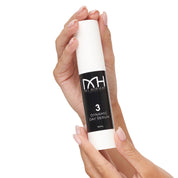 hands holding Dynamic Day Serum, a premium skincare product by Mel Hornery Cosmetics.