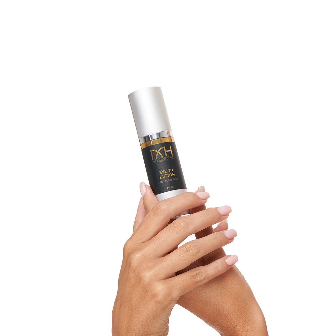 Hands holding Evelyn Dutton, a premium skincare product by Mel Hornery Cosmetics.