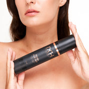 Model with clear skin holding FIona For Day, a premium skincare product by Mel Hornery Cosmetics.