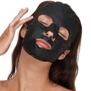 Model showcasing a Liam skincare mask product from Mel Hornery Cosmetics at a skin care clinic, highlighting effective and luxurious skin care solutions.