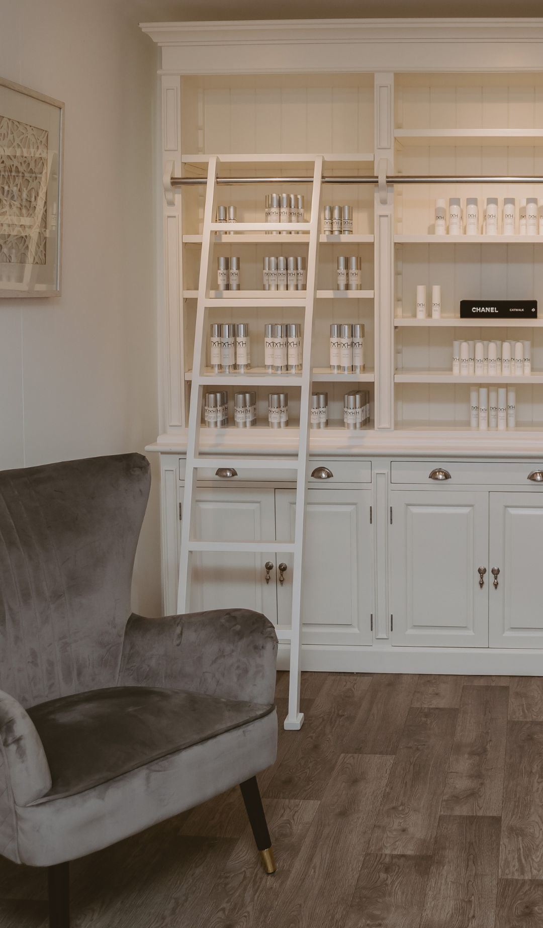 Mel Hornery Cosmetics wall of skincare products at their skin care clinic, featuring a diverse range of lotions, serums, and treatments arranged neatly on elegant shelves.